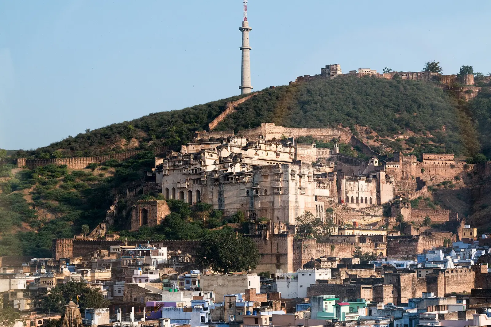 Garh Palace and Taragarh Fort on the hillside above the blue houses of Bundi