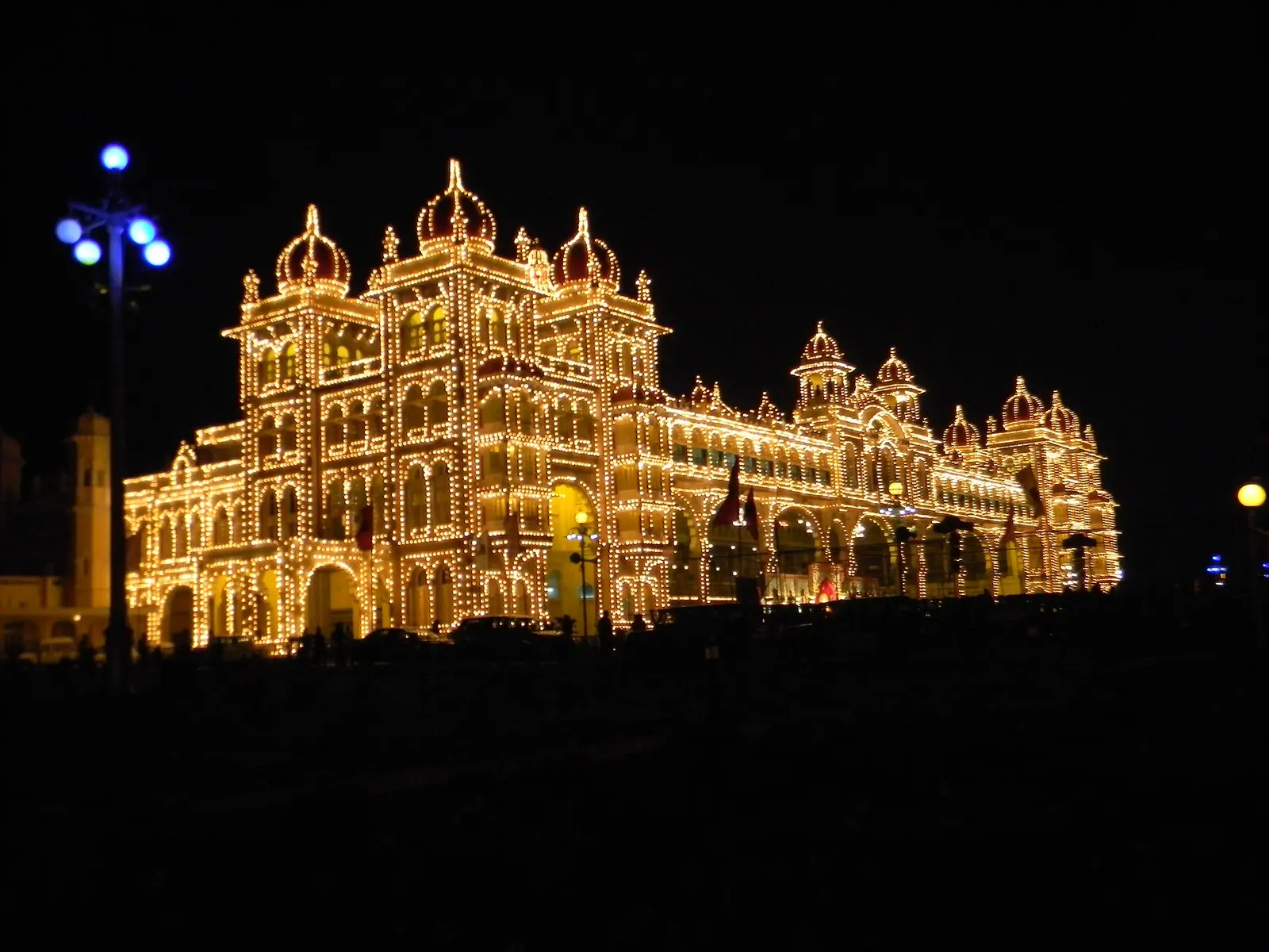 Mysore Palace outlined in lights during Dasara illumination